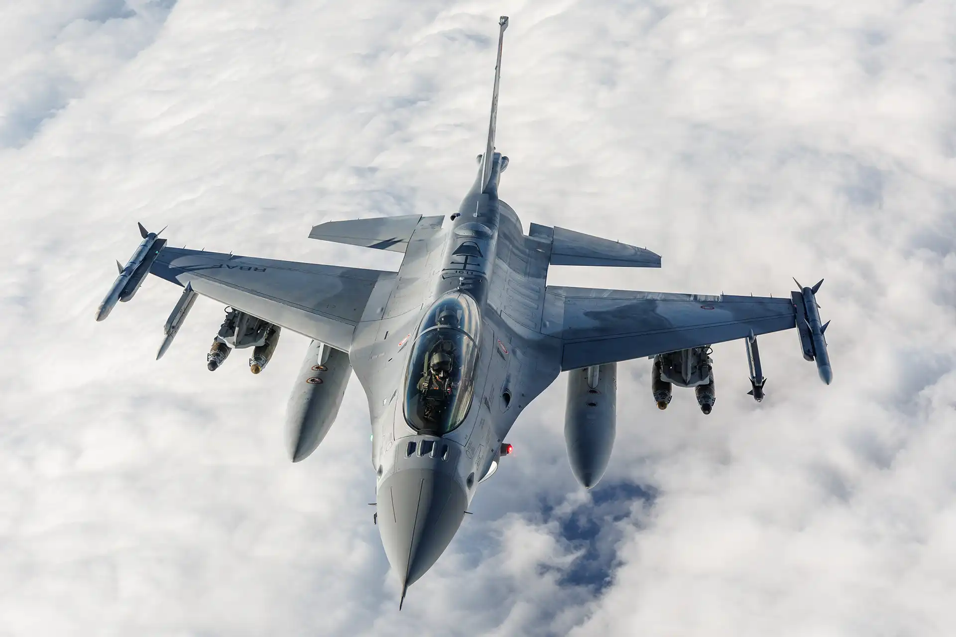 F-16 Block 70 fighter above the clouds